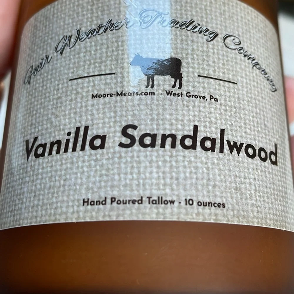 NWOT Vanilla Sandalwood candle. 10 0z. Hand poured amber glass wood lid one wick